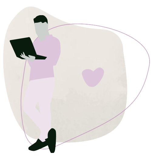 En mand står og kigger på sin laptop.